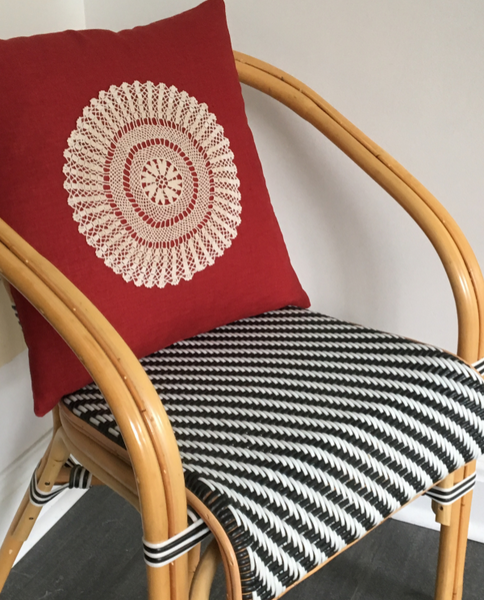 Red linen  cushion with crochet doily on retro chair - Shopping Blue